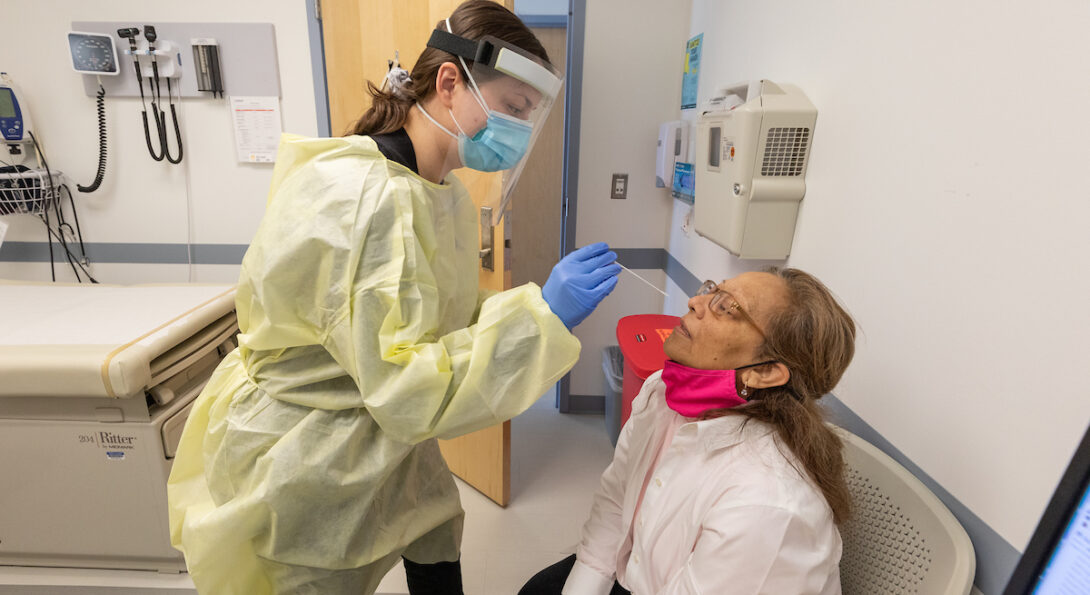 Alma Aguilar undergoes a nasal swab as she participates in the RECOVER research study at the University of Illinois Chicago, Thursday, March 10, 2022, at UI Health Mile Square Health Center. (Photo: Joshua Clark/University of Illinois Chicago)