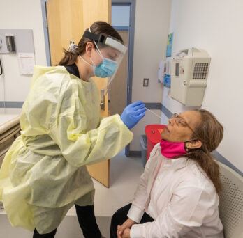 Alma Aguilar undergoes a nasal swab as she participates in the RECOVER research study at the University of Illinois Chicago, Thursday, March 10, 2022, at UI Health Mile Square Health Center. (Photo: Joshua Clark/University of Illinois Chicago)
                  