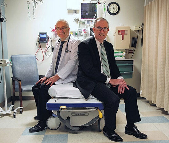 Dr. Terry Vanden Hoek, head of emergency medicine, left, and Steve Brown, director of preventative emergency medicine and the Better Health Through Housing program.