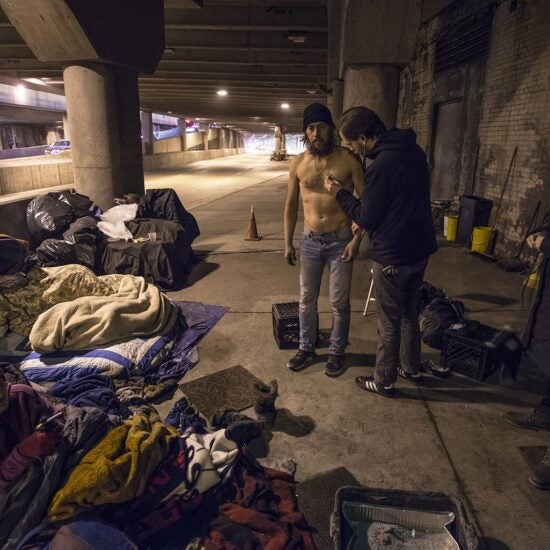 Man on lower Wacker receiving care