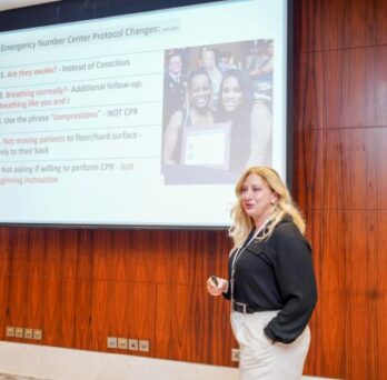 Beth Frolich in front of her presentation 