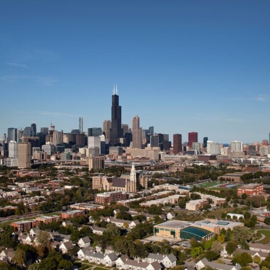 Aerial view of the Chicago skyline with prominent buildings, including Willis Tower, on a clear day.