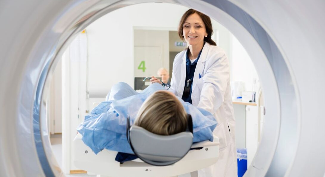 Doctor talking to patient who is going through a MRI scan