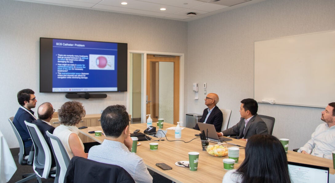 UIC Researchers visit with Neeraj Agarwal, MD, FASCO, the Research Training Program Director at the NEI, during the 2024 UIC K12/Independent Clinician Vision Scientist Program Meeting.