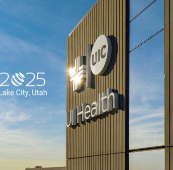 Close up of the corner of the UI Health Specialty Care Building with the ARVO logo to the left.
                  