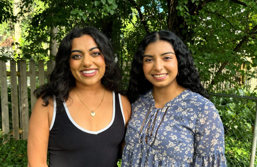 Priya (left), Nikita (right) smile for a picture