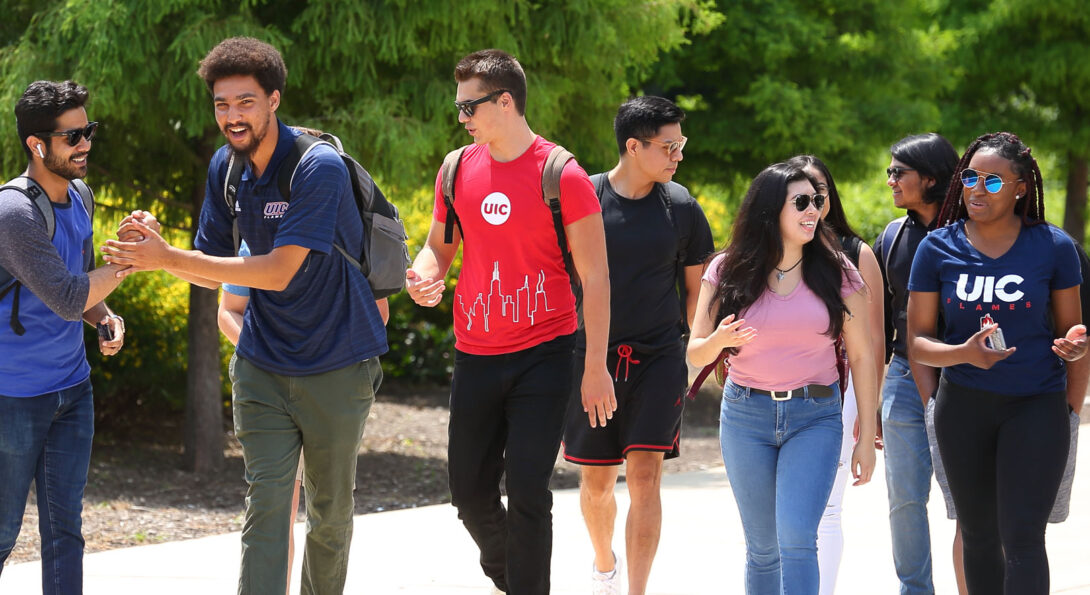 A group of students walk together outside.
